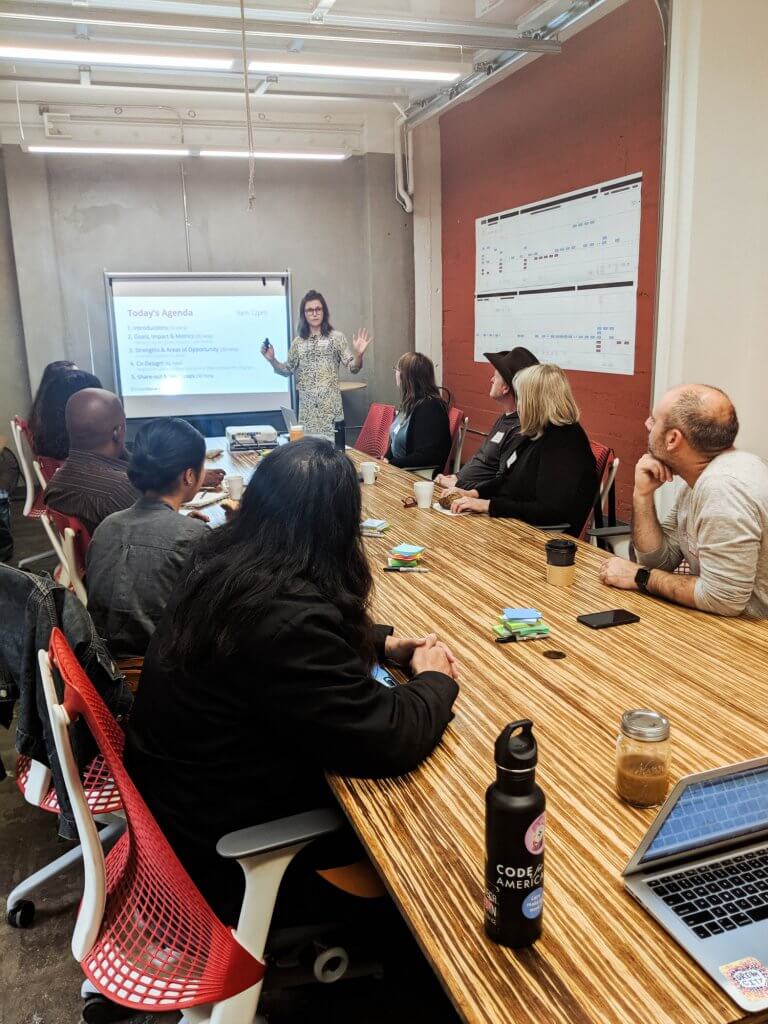 Cristelle is presenting insights from SF Shines research to collaborating stakeholders at a co-design session.