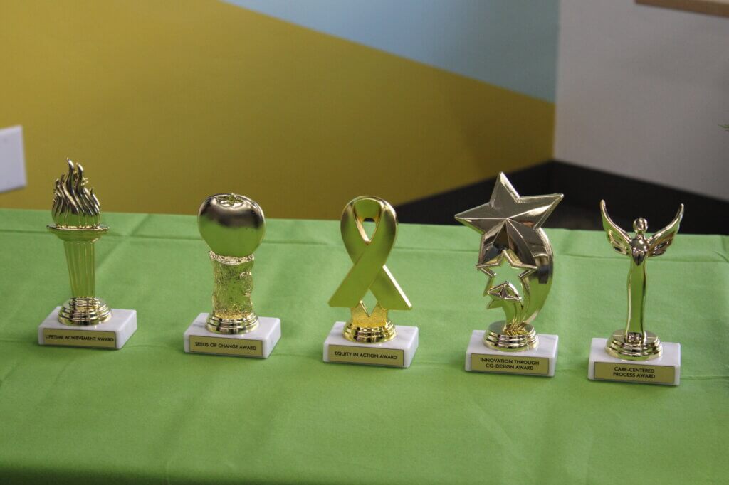 four trophies sitting on a table